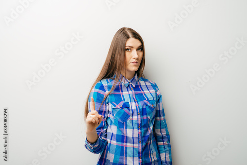 Business woman pointing an idea and smiling - isolated over white