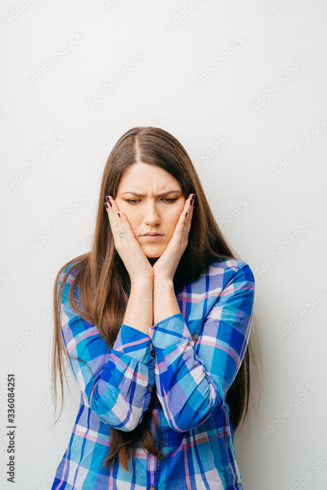 on a white background young girl sad on a white background young girl sad