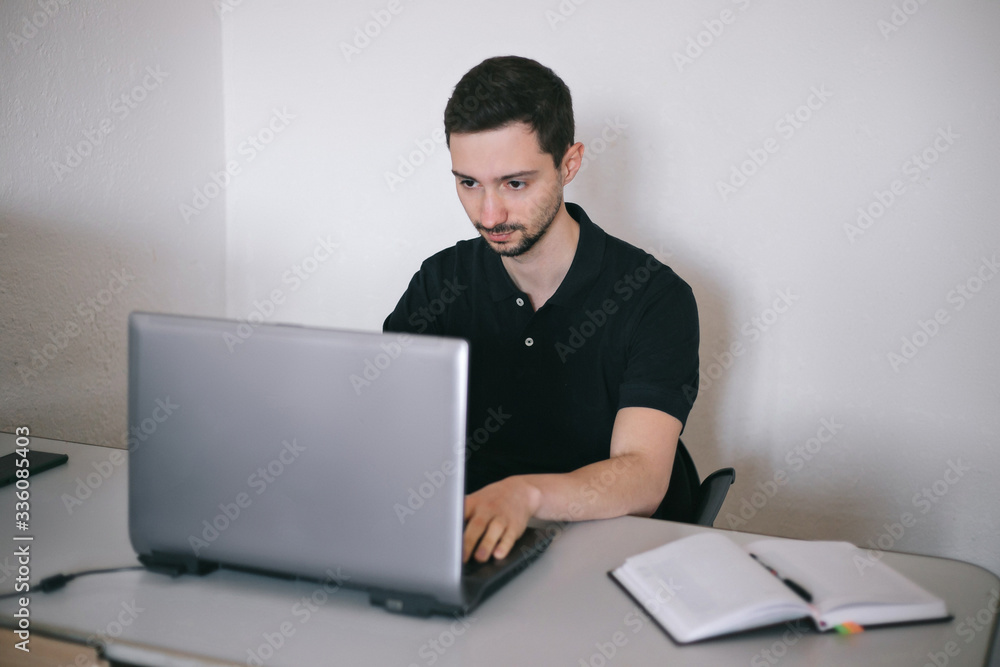 Young man working with a laptop