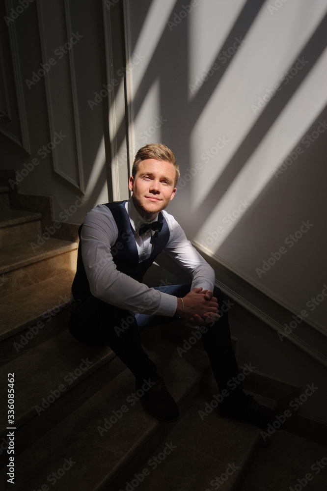 Portrait of the groom before the wedding ceremony in hard light. Portrait of the groom before the wedding ceremony in hard light.