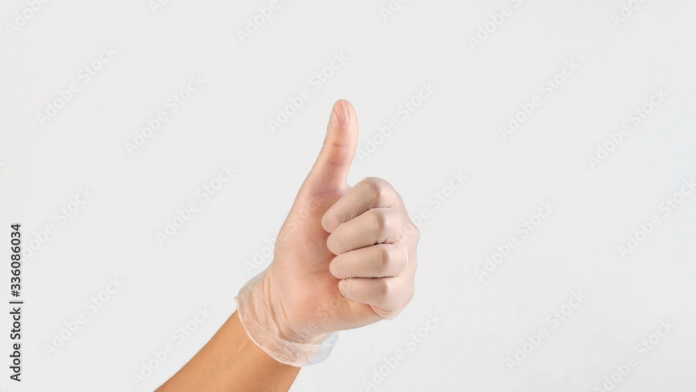 female hand in plastic medic glows in like gesture on white