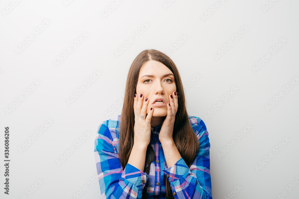 long-haired beautiful girl scared, isolated on a white background long-haired beautiful girl scared, isolated on a white background