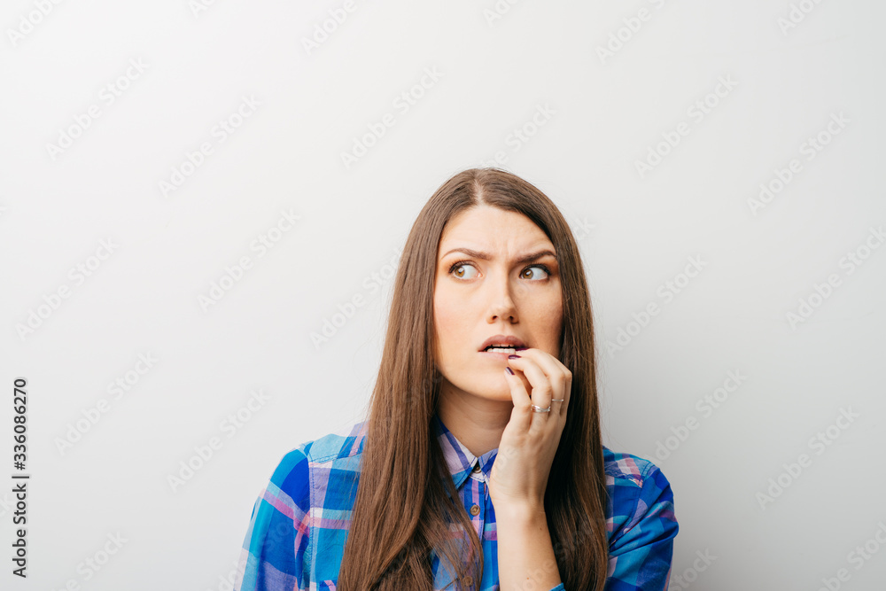 long-haired beautiful girl scared, isolated on a white background long-haired beautiful girl scared, isolated on a white background