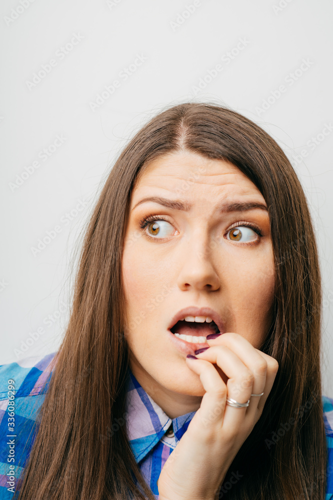 long-haired beautiful girl scared, isolated on a white background long-haired beautiful girl scared, isolated on a white background