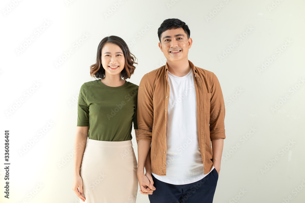 Portrait of happy couple isolated on white background. Attractive man and woman being playful. Portrait of happy couple isolated on white background. Attractive man and woman being playful.