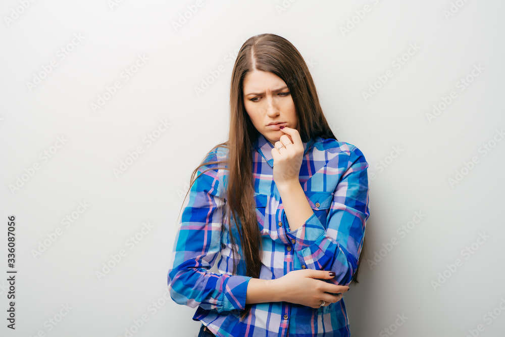 health and beauty concept - face of beautiful young woman covering her mouth with hand health and beauty concept - face of beautiful young woman covering her mouth with hand