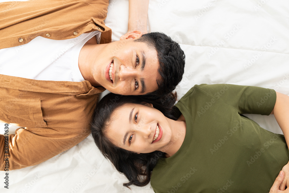 Romantic couple in love looking at each other.. Top view of smiling young couple Romantic couple in love looking at each other.. Top view of smiling young couple