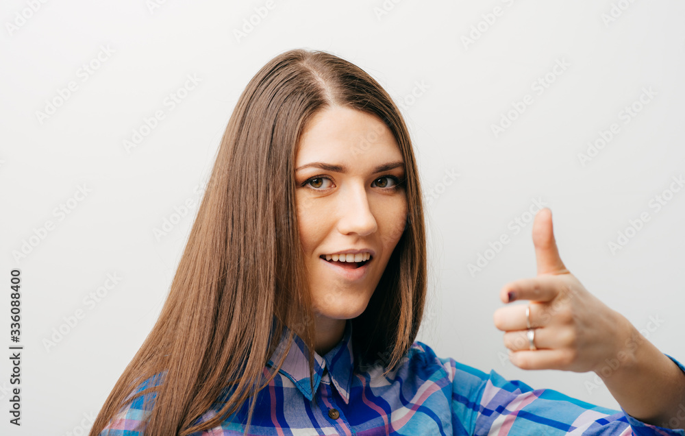 young woman pointing finger for someone young woman pointing finger for someone