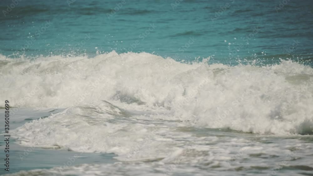 Slow Motion shot of Beautiful Blue Giant Ocean Wave Crashing at golden sandy beach
Slow Motion shot of Beautiful Blue Giant Ocean Wave Crashing at golden sandy beach