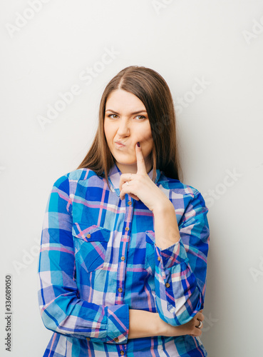 young casual woman thinking