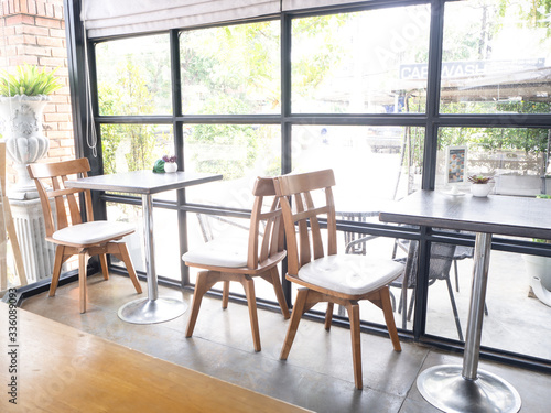 Cafe with brick cafe and bar interior   row of chairs near glass windows