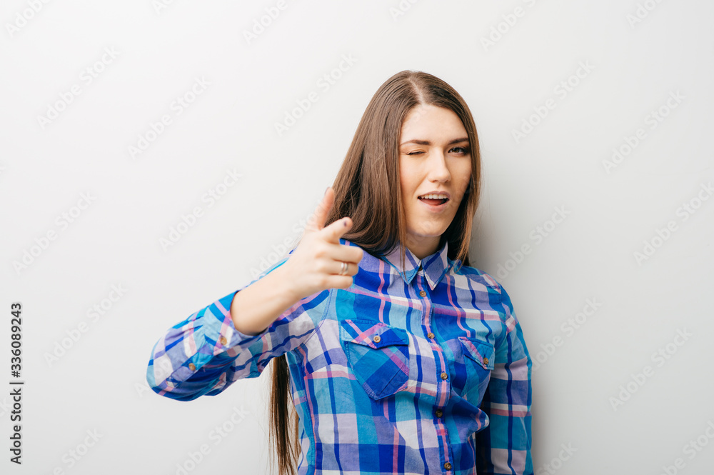 young woman pointing at someone gesture with finger young woman pointing at someone gesture with finger