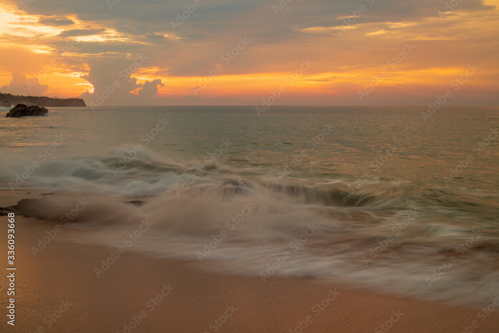 Seascape. Sunset time at the beach. Ocean with strong waves. Tegal Wangi beach, Bali, Indonesia