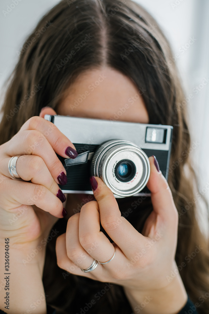 beautiful woman holding old camera at home beautiful woman holding old camera at home