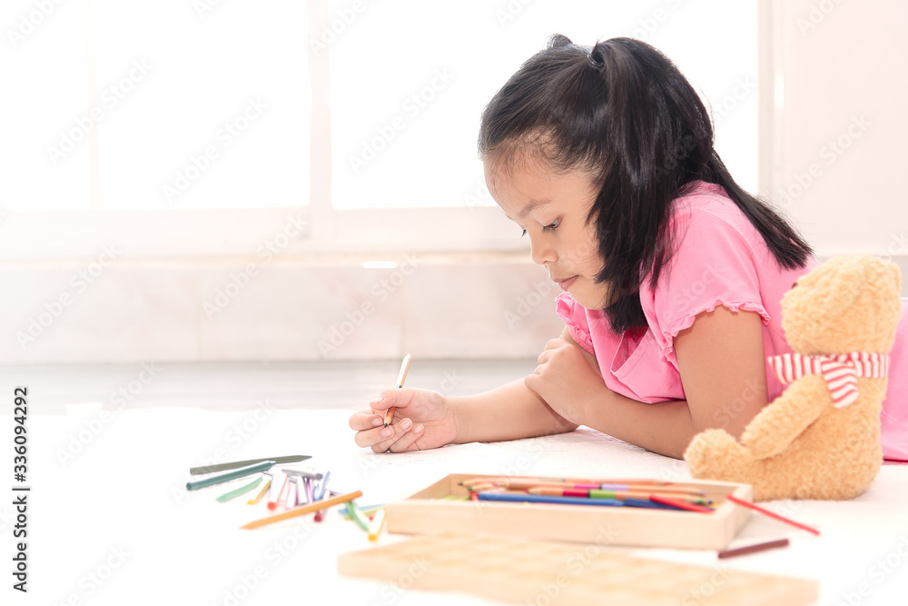 Little girl drawing at home for quarantine durin coronavirus. Kids playing alone at home. Little girl drawing at home for quarantine durin coronavirus. Kids playing alone at home.