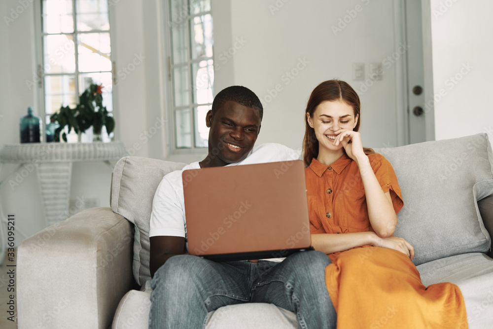 couple using laptop at home couple using laptop at home