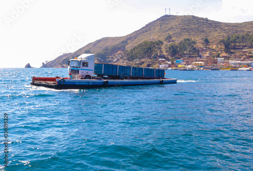 Bolivia Titicaca lake wooden ferry with trucks on board