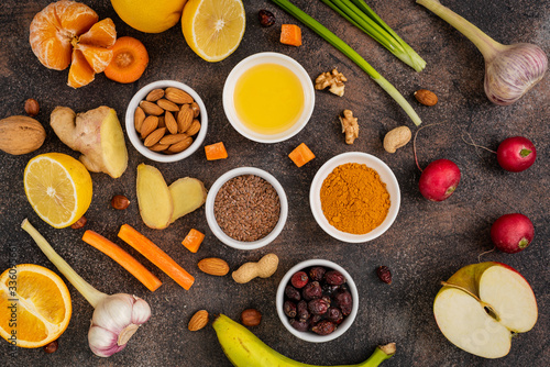 Healthy foods to enhance immunity on a dark background. Vegetables and fruits to strengthen the immune system. Top View.