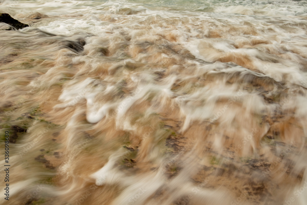 Scenic seascape. Waterscape for background. Slow shutter speed. Soft focus. Motion blur waves. Tegal Wangi beach, Bali