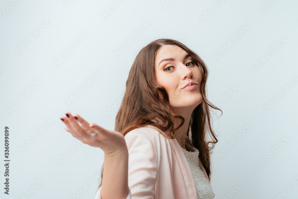 cheerful beautiful brunette girl shows she does not know what to do cheerful beautiful brunette girl shows she does not know what to do