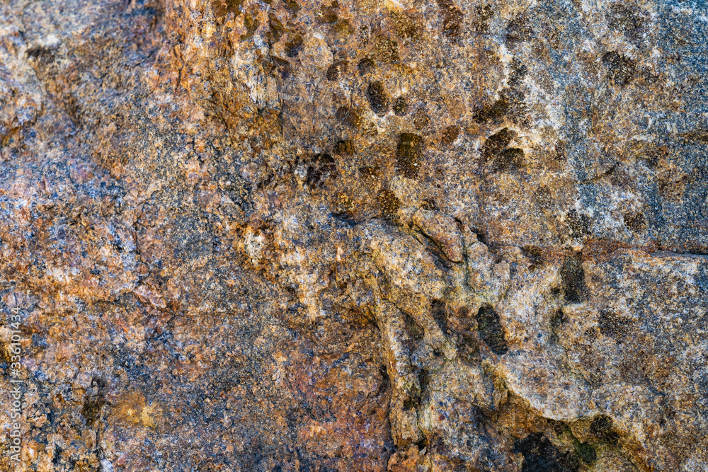 Texture of natural rock granite natural rock granite, magmatic structure with quartz and mica and traces of erosion. Texture of natural rock granite natural rock granite, magmatic structure with quartz and mica and traces of erosion.
