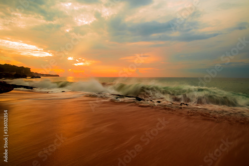 Seascape. Sunset time at the beach. Ocean with strong waves. Ocean background. Tegal Wangi beach, Bali, Indonesia © Olga
