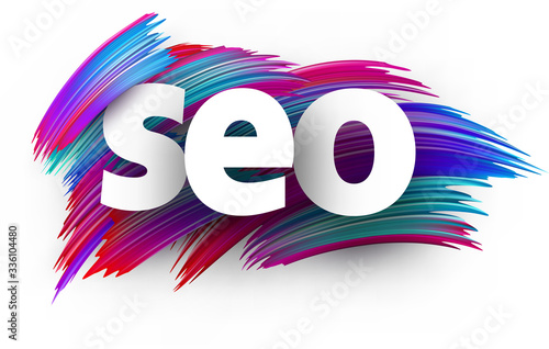 Seo sign letters on brush strokes background.