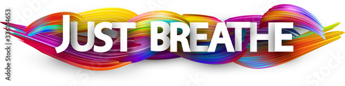 Big just breathe sign on brush strokes background.