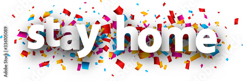 Stay home sign over confetti background.