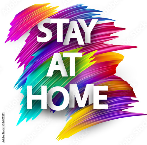 Big stay at home sign over brush strokes background.