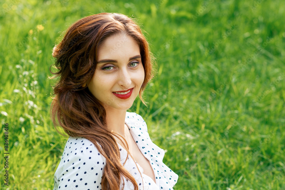 Portrait of beautiful young smiling woman on green background of summer nature. Portrait of beautiful young smiling woman on green background of summer nature.