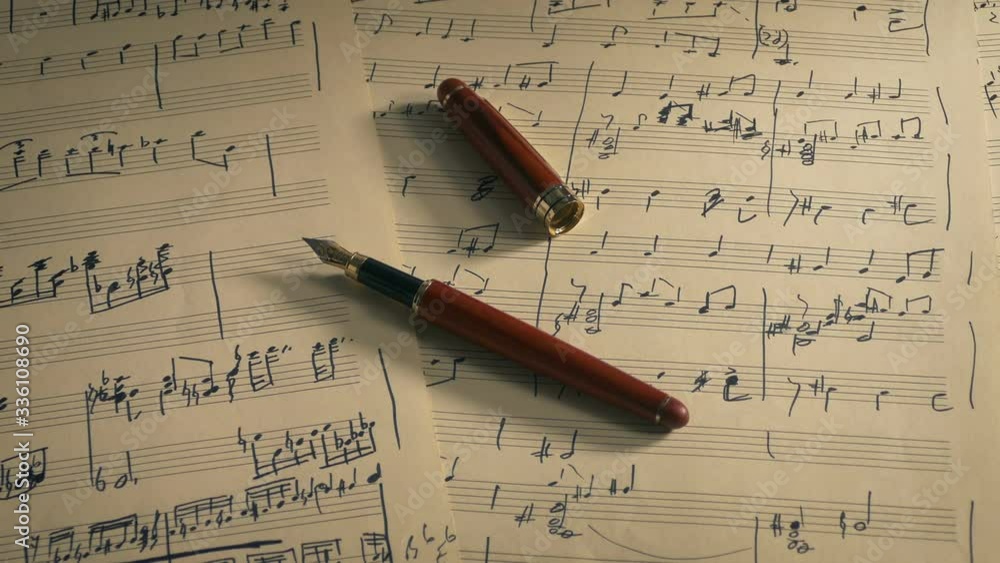 Writing Music Concept - Ink Pen On Sheet Music Writing Music Concept - Ink Pen On Sheet Music
