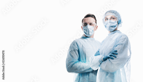Obraz na płótnie doctors man and woman on a white background in medical masks on the face w salonie