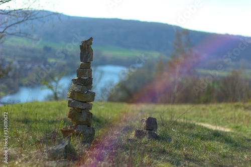 Mystic stone tower in front of a landscape with color refractions © Patrick