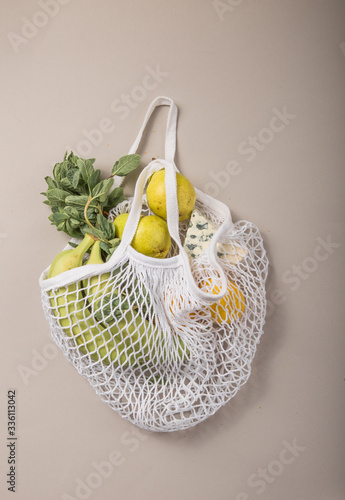 Zero waste cconcept. Package-free food shopping. Eco friendly natural bag with organic fruits and vegetables. Sustainable lifestyle concept. Plastic free items. Reuse, reduce, refuse. Top view.