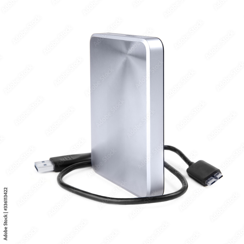 External silver hard disk drive 2.5 inches with a usb cable isolated on white External silver hard disk drive 2.5 inches with a usb cable isolated on white