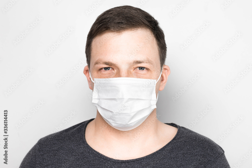Man with medical mask on face. Protection against viruses and infections. Stay home, corona virus. Man with medical mask on face. Protection against viruses and infections. Stay home, corona virus.