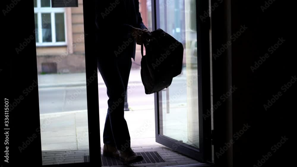 Businessman returning to home from trip Businessman returning to home from trip