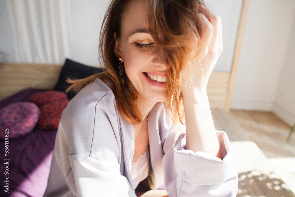 beautiful young woman smiling and having fun in bed beautiful young woman smiling and having fun in bed