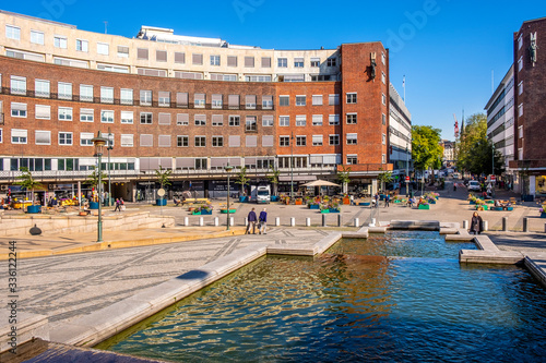 Oslo, Ostlandet / Norway - 2019/08/30: Fridtjof Nansens plass square in front of Oslo City Hall historic building - Radhuset - in Pipervika quarter of city center photo