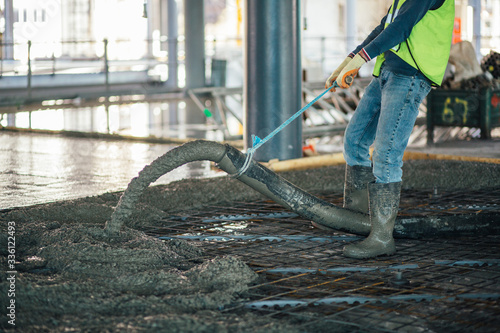 Construction worker pouring concrete © Matt