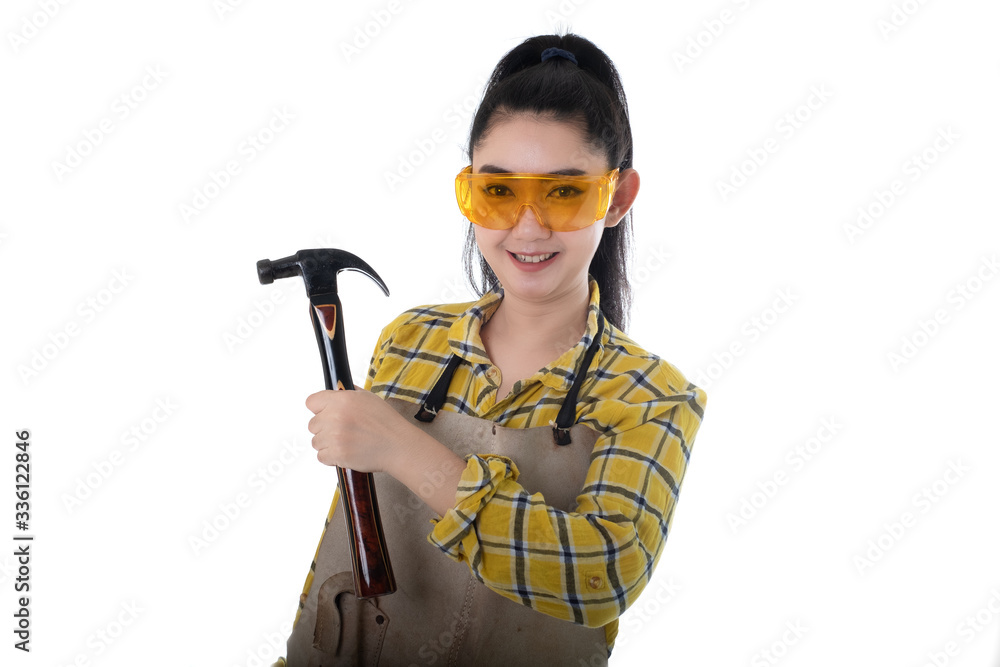 Portrait young Asia woman carpenter hand holding hammer looking forward and thinking of a white background, Planning on construction building concept Portrait young Asia woman carpenter hand holding hammer looking forward and thinking of a white background, Planning on construction building concept