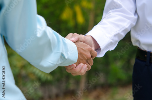 Handshake of two businessmen agreed with the success of the new project.