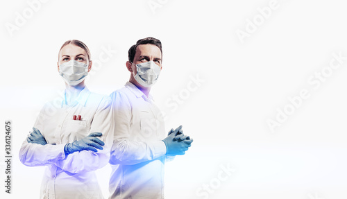 doctors man and woman on a white background in medical masks on the face