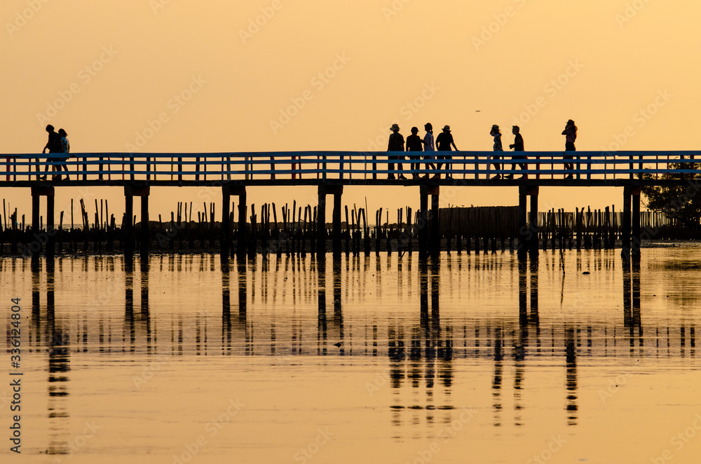 Wooden bridges and people against the sunset sky background, Silhouette image