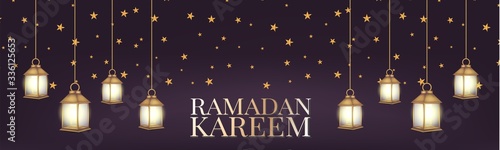 Ramadan Kareem banner or long header. Arabic religious holiday concept. Hanging golden lantern and stars over dark purple background. Vector illustration with lettering.