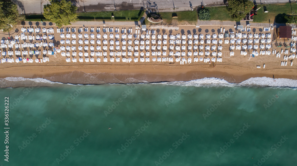 Top down view of beautiful beach with white umbrellas. Golden sands, Varna, Bulgaria