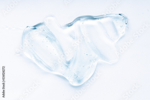 Transparent liquid gel cream smudge on white background © VERSUSstudio