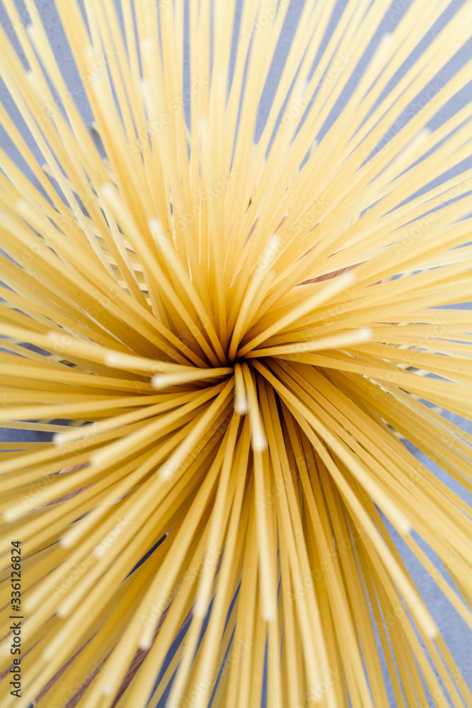Uncooked pasta spaghetti macaroni on blue background, Uncooked pasta spaghetti macaroni on blue background,