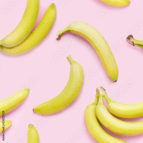 Bananas on a pink background, top view. Seamless pattern, food background.